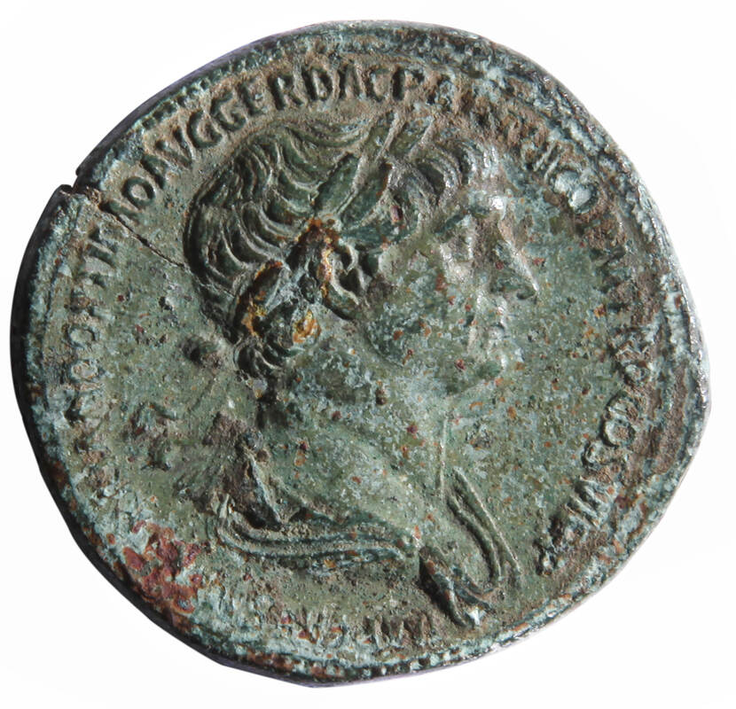 Foto van een munt met de afbeelding van Sestertius Trajanus